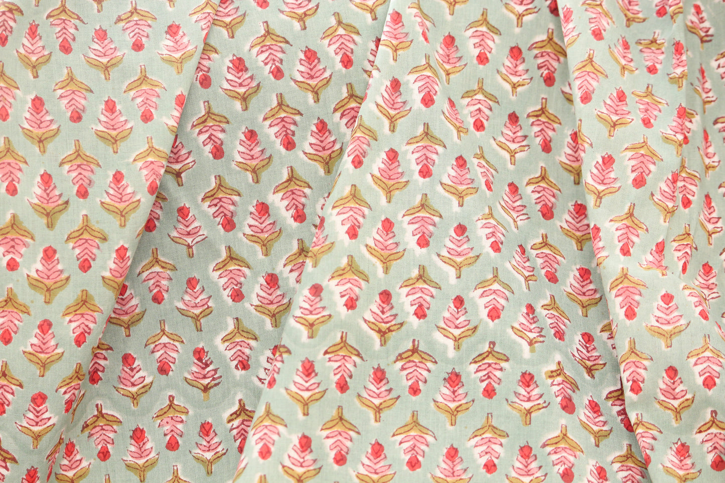 Green with red pink small motifs hand printed cotton fabric