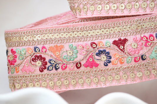 beautiful hand embroidery ribbon trim in baby pink with small blue and maroon floral details. great for bridal bouquet, girls bow making, bag handles, camera handles and other sewing projects.