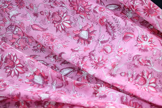 Sugar candy pink hand block printed cotton fabric with maroon and red beautiful floral motifs. The fabric can be used for all sewing projects. Great for little girls dresses, home decor, storage bags, tote bags, curtains, napkins etc