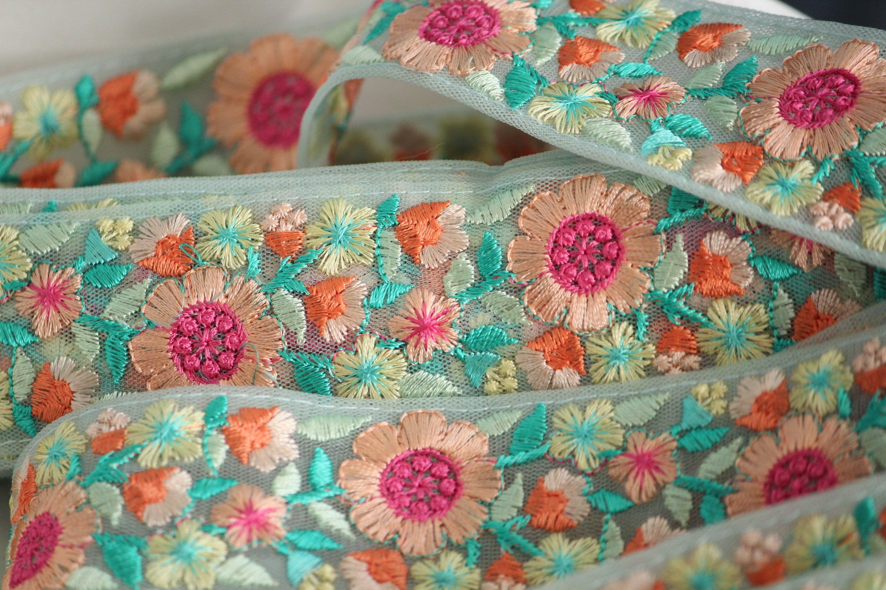Aqua peach pink floral thread embroidery ribbon on mint mesh